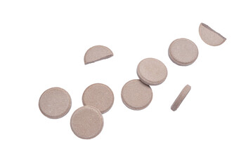 Milk tablet, Milk pellets. Chocolate  milk tablet falling in the air on a white background with clipping path.