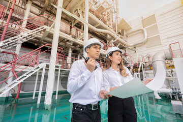 The nuclear power plant industry benefits from the collaborative work of Asian male and female...