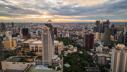 Aerial view of boats floating over turquoise waters in  with scattered debris near the shoreline as boat pollutes in sandy waters marine pollution concept 