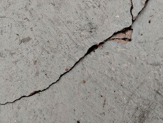 the house wall is cracked. The crack was caused by extreme weather