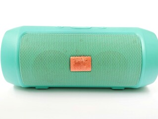 light blue portable bluetooth speaker on a white background.