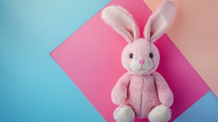 Obraz premium Pink rabbit doll with big ears isolated on colorful background