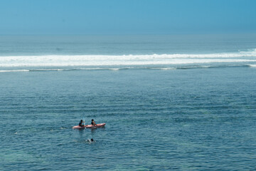 People canoeing in Gunung Payung Beach, Nusa Dua, Bali, Indonesia