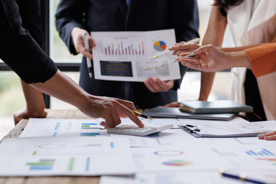 Analyze financial data and accounting record with calculator in meeting office, Accounting company charts and graphs banner, double exposure successful business finance and taxation planning concept.