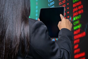 Young business woman holds a tablet and touches the screen. market report big data analysis technology Processing complex data streams on intelligent technology background.
