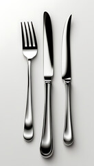 A clean illustration of a silver fork and knife, isolated on a plain white background. Ideal for food-related designs, restaurant branding, or product mockups