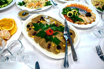 festive table setting - salads, cold snacks, fruits