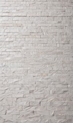 a close-up view of a white marble-like stone wall, with a textured and uneven surface.