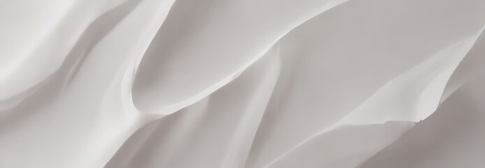 Fototapeta premium a close-up view of a white fabric surface with a subtle texture, featuring curved lines and a smooth, flowing pattern.