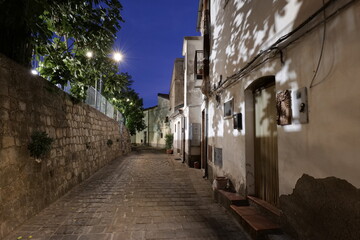 A small street in the evening in Colobraro, a village in Basilicata, Italy.