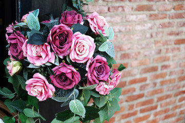 Blooming pink bouquet roses decorated the doorway at a wedding for bridal floral and valentine day