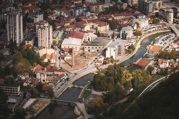 Fototapeta premium View of the city buildings with a river in the middle, Uzice, Serbia 