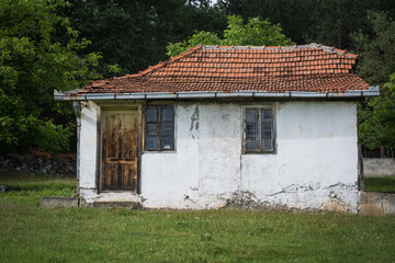 White weathered small house in a rural area