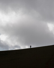 silhouette of a person standing on a roof