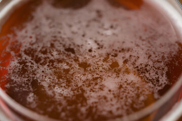 close up amber beer surface