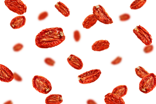 Falling dried Tomato isolated on white background, selective focus