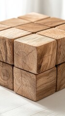 A stack of wooden blocks with a smooth texture, arranged in a cube shape, highlighting their natural grain and craftsmanship.