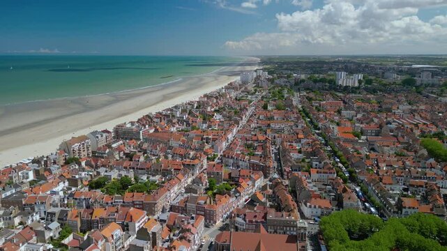 The drone aerial footage of beach and the city of  Dunkirk, France. Dunkirk is a commune in the department of Nord in northern France.