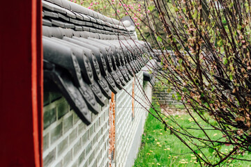 decorative wooden elements on an old gazebo and shaped metal rivets