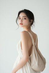 Fototapeta premium Fashionable Woman with Minimalist Background