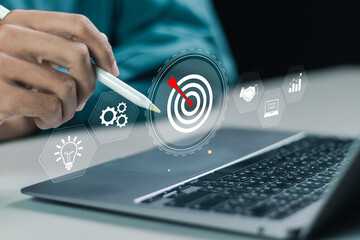 Targeting business concept, business objective. Businessman using laptop with target icon for...