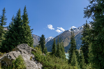 Obraz premium Beautiful mountain landscape, forest and mountains in summer time. Valley in Kazakhstan.