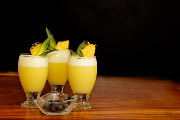 Refreshing piñacolada cocktails with black background. Copy space. Black friday.