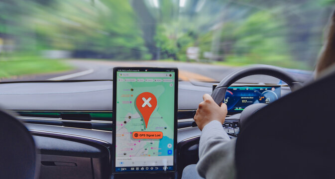 Car navigation GPS signal lost on a dashboard display while driving on a curvy road