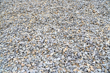 Textures of crushed stones  in a construction site, showcasing natural colors and materials in the heart of the city