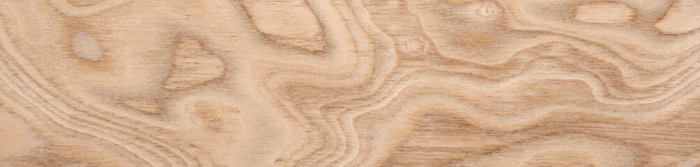 Swirling golden patterns and contours on a smooth plywood veneer surface