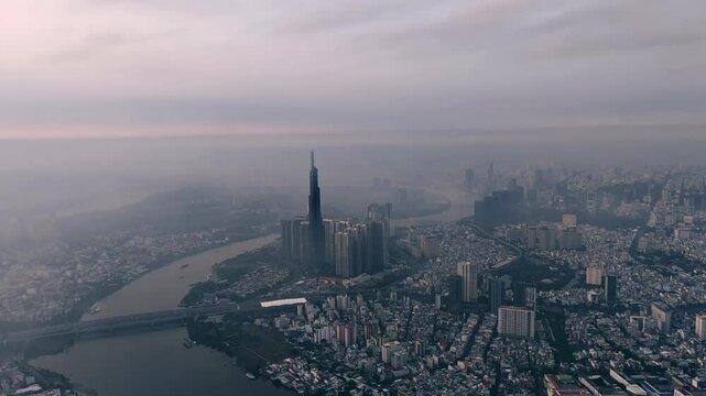 Panoramic view of Saigon, Vietnam from above at Ho Chi Minh City's central business district. Cityscape and many buildings, local houses, bridges, rivers 