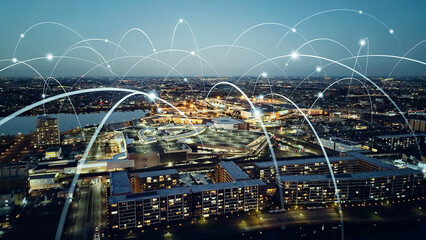 Mixed media of modern city aerial view and digital technology concept.