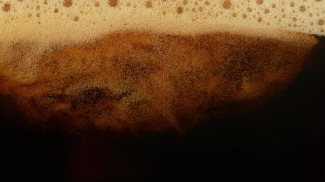 Super Slow Motion Detail Shot of Pouring Fresh Creamy Coffee at 1000fps.