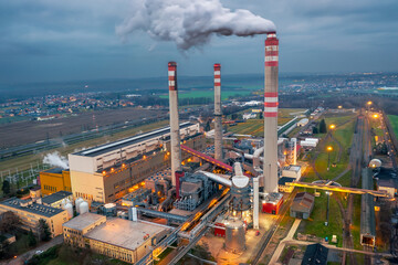 Coal power plant Opatovice nad Labem with smoking chimney during cloudy morning