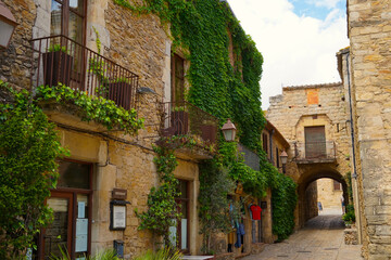 Peratallada, historic centre with small alleys and medieval Romanesque buildings at at a sunny day with blue sky, Pals, Begur, Girona, Catalonia, Costa Brava, Spain