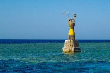 Navigational sign on the dangerous underwater Red Sea