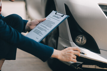 A young businesswoman is navigating car insurance options at her desk, considering premiums, deductibles, and coverage while understanding policies and managing claims efficiently.