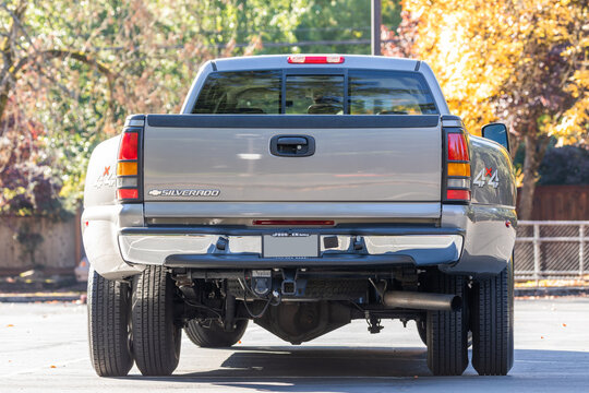 Portland, OR, USA - Oct 7, 2021 - 2006 Silver Chevy Silverado 3500 Duramax 6.6L Turbo Diesel dually classic pickup truck American 4X4 SUV off-road vehicle exterior. High quality picture for download.
