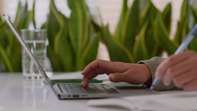 Unrecognizable woman girl african lady employee business worker agent student teacher at table online studying laptop distant education write notes female businesswoman work computer writing notebook