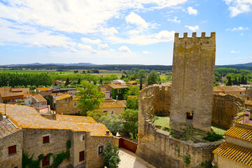 view from the old Torre de les Hores tower in Peratallada over the historic centre with small alleys and medieval Romanesque buildings and the Castle of Peratallada, Pals, Begur, Girona, Catalonia
