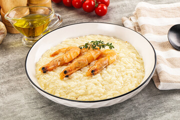 Italian risotto with prawn served thyme