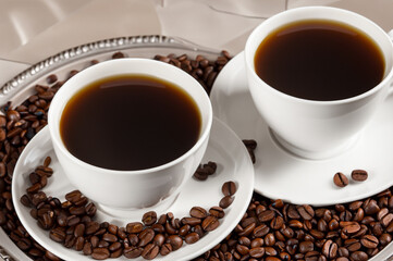 some coffee beans and a cup of coffee