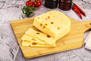 Maasdam cheese piece with slices