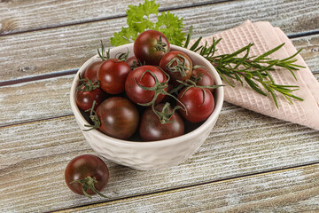 Juicy ripe black cherry tomato