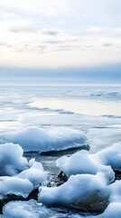 Obraz premium Frozen ice floes drift on a calm, blue lake.