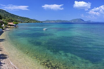 Beautiful beach with sea, sun and blue sky. Concept for travel and summer vacation. Greece-island of Corfu.