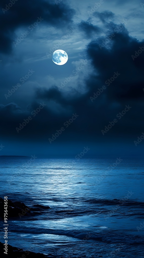 Wall mural A full moon shines over a calm ocean, casting an ethereal glow on the water.