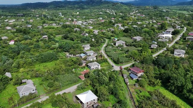 flying around the village on a drone in the mountains , bird's eye view, Guria, Georgia