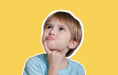 Boy toddler portrait close-up, he is playing and posing, grimacing, making funny face. The child...