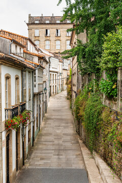 Fototapeta Narrow streets with medieval buildings in the monumental city of Santiago de Compostela, Galicia.